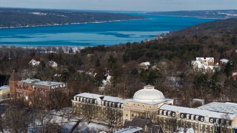 a wintery view of the river and campus